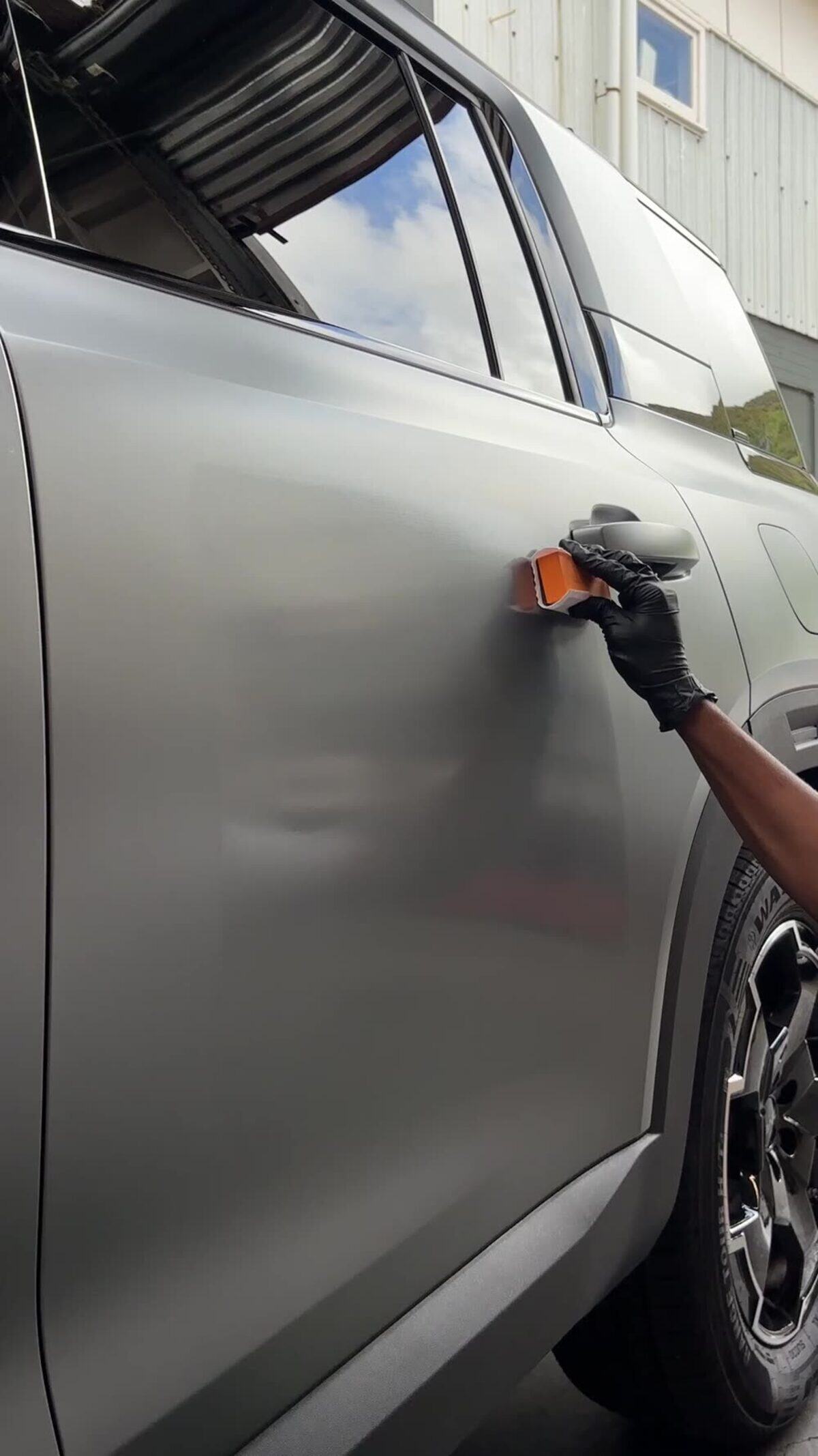 Deep gloss and mirror reflections in a freshly coated door panel