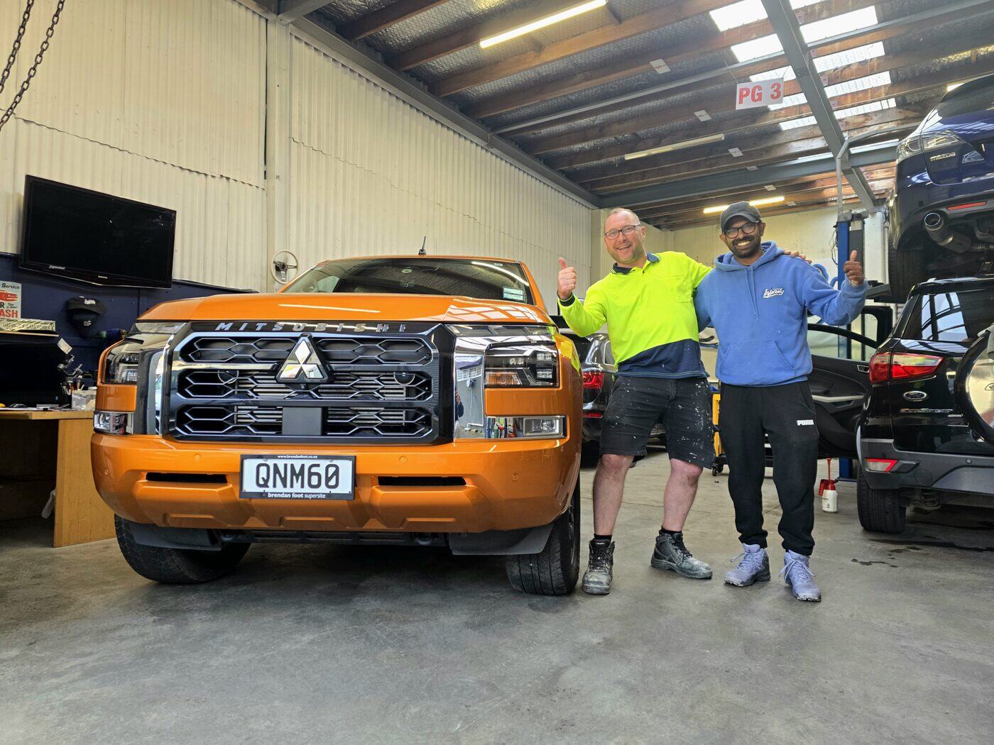 Handing a freshly detailed Mitsubishi Triton back to its owner at our Taita workshop