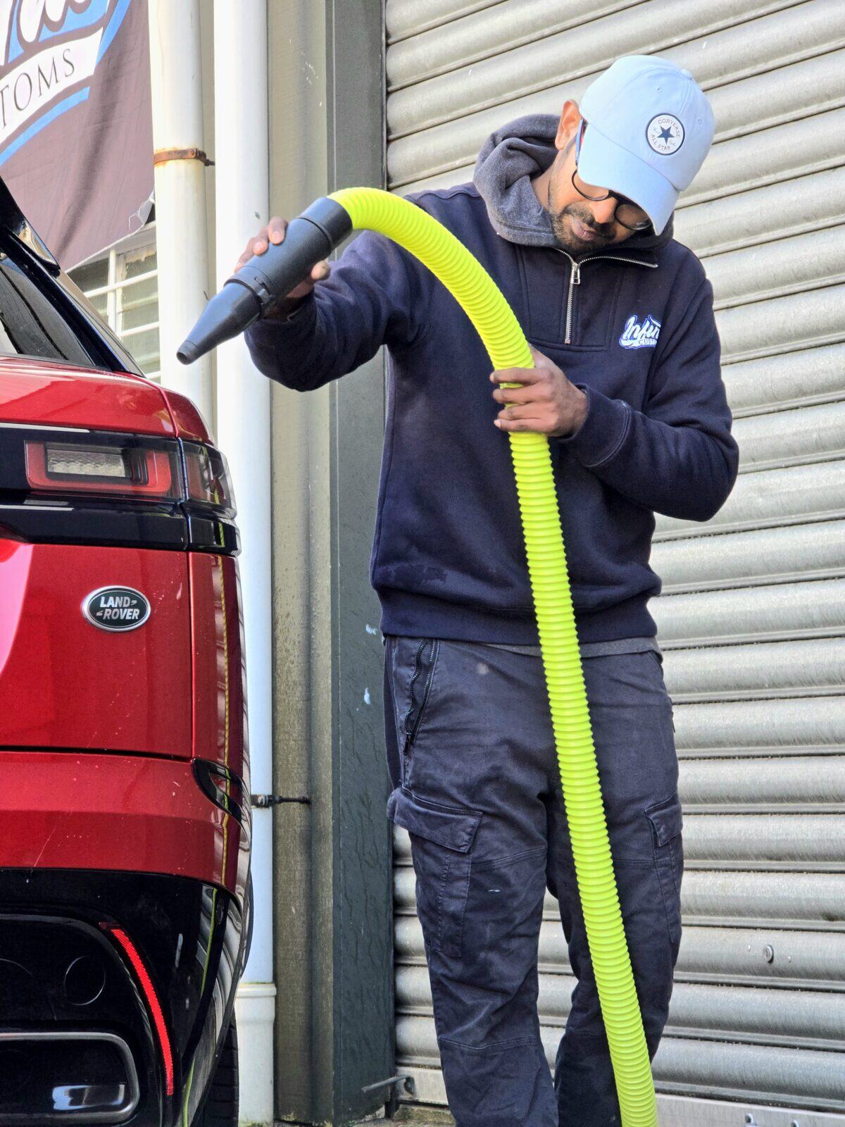 Blowing out and detailing the interior of a Range Rover in Lower Hutt
